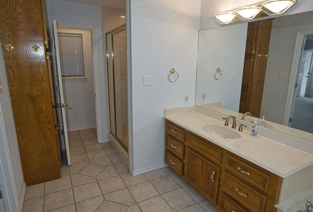 Large Shower, Linen closet for storage.
