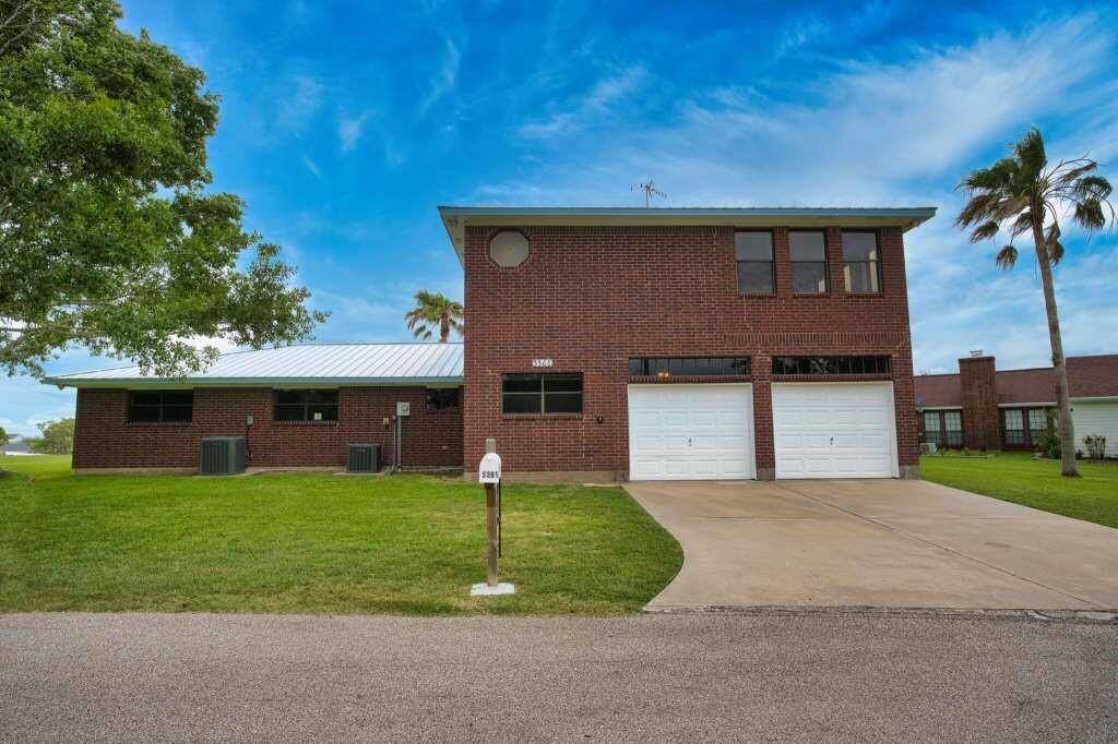 Downstairs is the Main Living Area.  Above the Garage is the Primary Suite & Sunroom