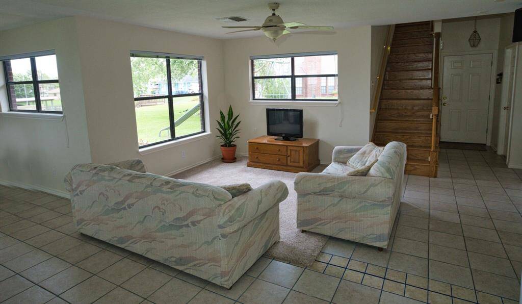View as you enter from the Garage. Carpet can easily be removed, tile below.