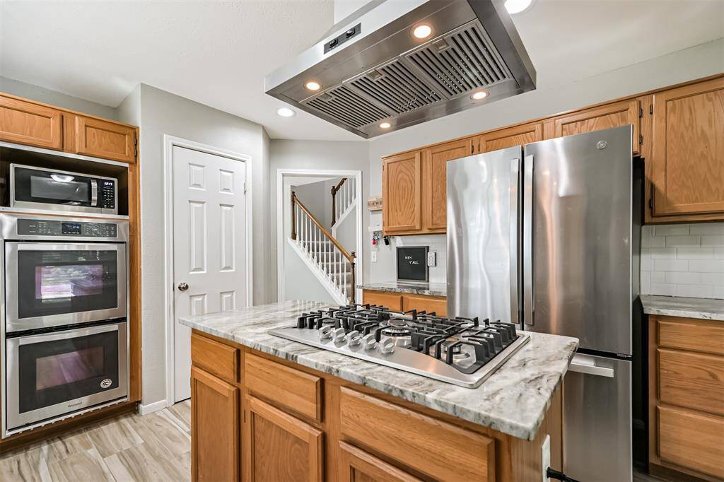 All updated stainless steel appliances and beautiful granite countertops