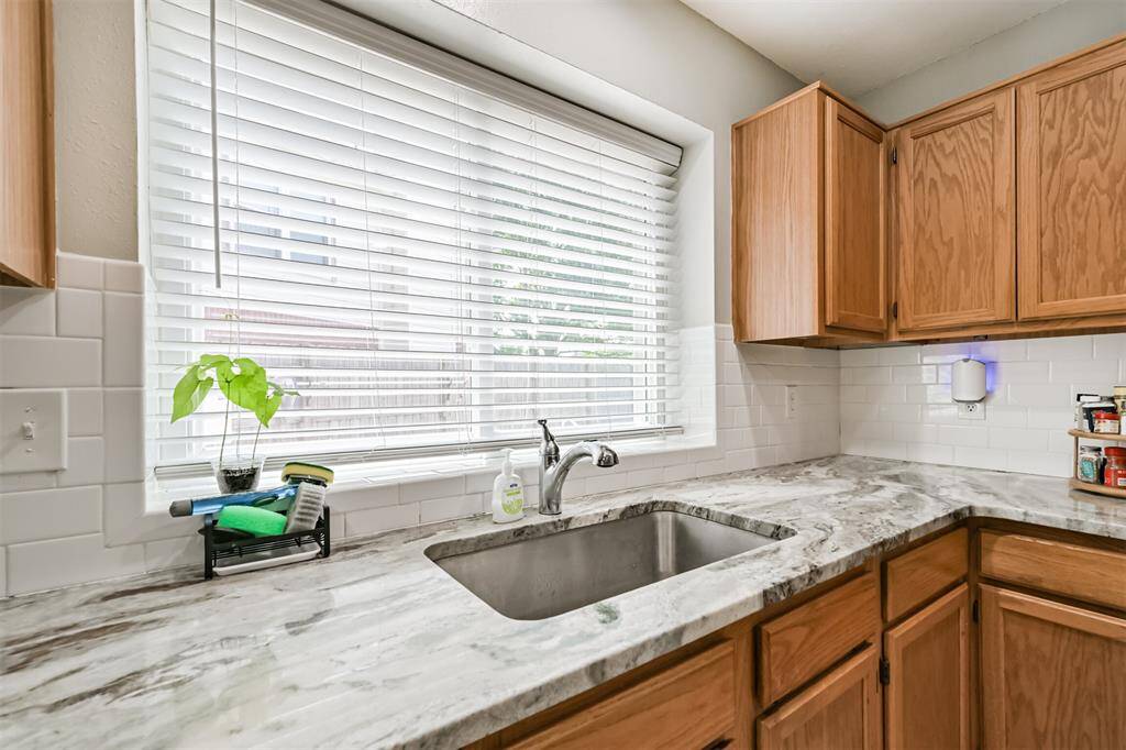 Large kitchen sink with window overlooking the pool