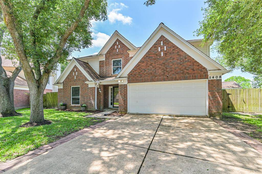 Located on a large corner lot with beautiful mature trees to shade the front yard.