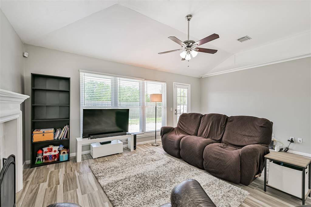 Tons of natural light in the living area from the wall of windows