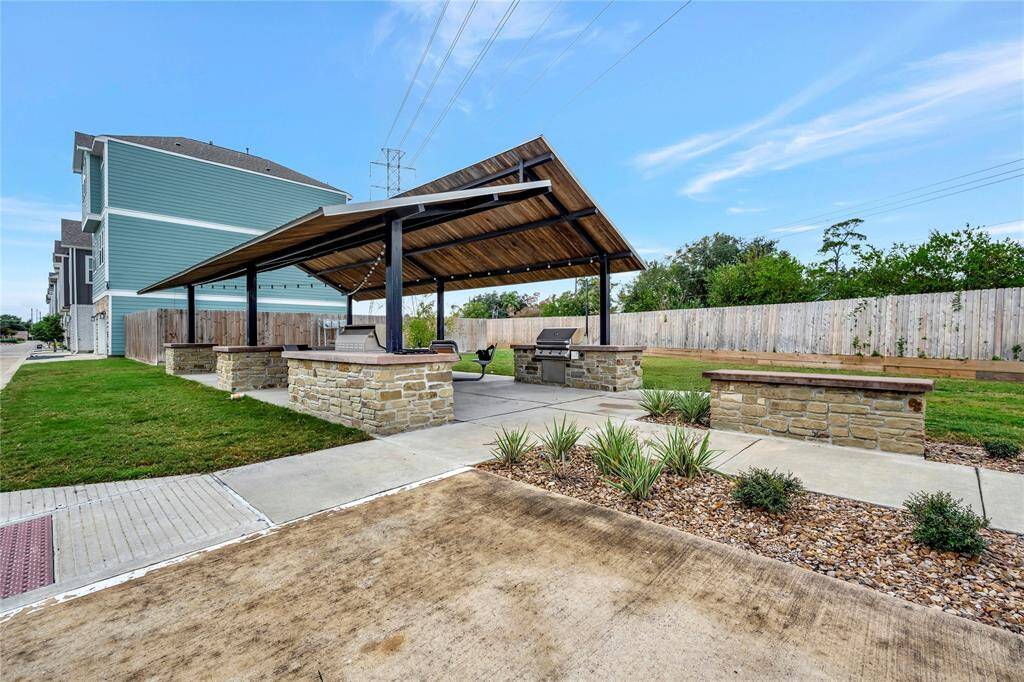 This inviting communal covered gathering area provides a perfect space for residents to relax, socialize, and enjoy the outdoors in comfort. Whether you're hosting a casual get-together or simply unwinding after a busy day, this sheltered space offers protection from the elements while allowing you to enjoy the fresh air.