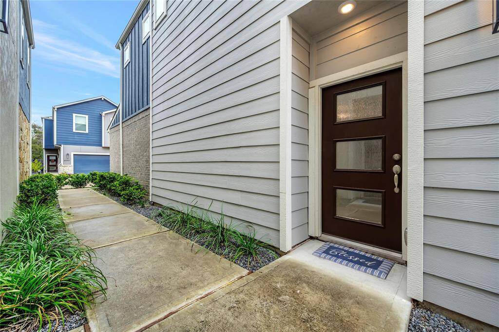 Modern 3 panel door welcomes you.