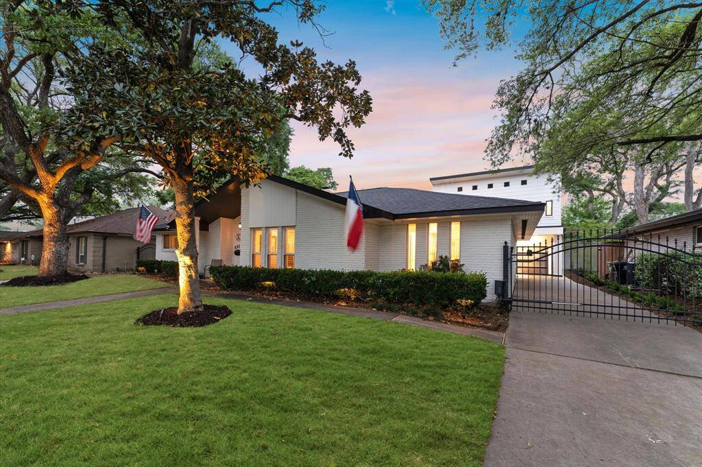 Delightful modern home with a well-maintained front lawn, mature trees, and a gated driveway. Ideal for comfortable living in a serene neighborhood.