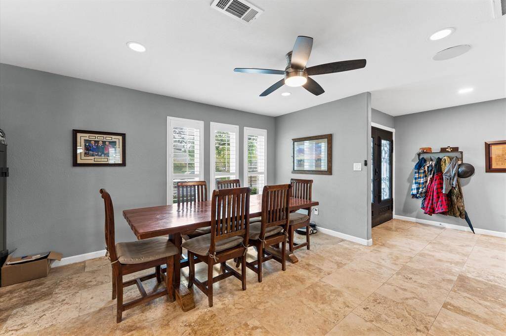 An open dining area with plenty of natural lighting.