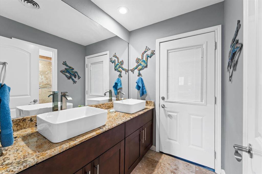 Solid wood cabinet with solid slab granite counter top, double porcelain basin/sink and Nickel finish hardware