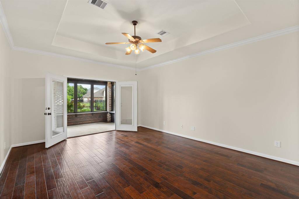 Escape to your serene primary suite, boasting stylish upgraded wood floors, a convenient ensuite bath, and a private covered balcony perfect for quiet moments.