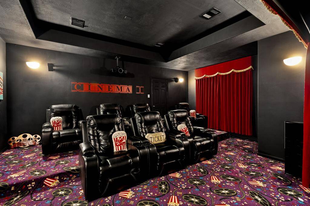 Immerse yourself in cinematic bliss in this media room, featuring complete blackout curtains, luxurious custom carpet, and the perfect ambiance for unwinding and enjoying your favorite movies.