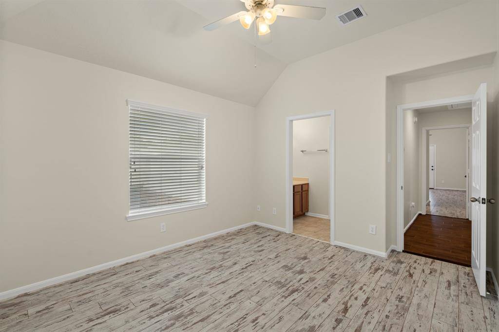 Enjoy privacy and comfort in this upstairs bedroom, complete with its own ensuite bathroom and beautiful upgraded flooring.