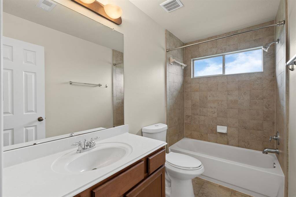 Enjoy the convenience and privacy of this ensuite bathroom, perfectly situated within the second-floor bedroom.