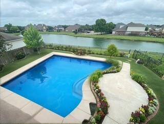 Unlock the potential for your own backyard oasis! This rendering showcases how a sparkling pool could transform this space into your personal paradise.