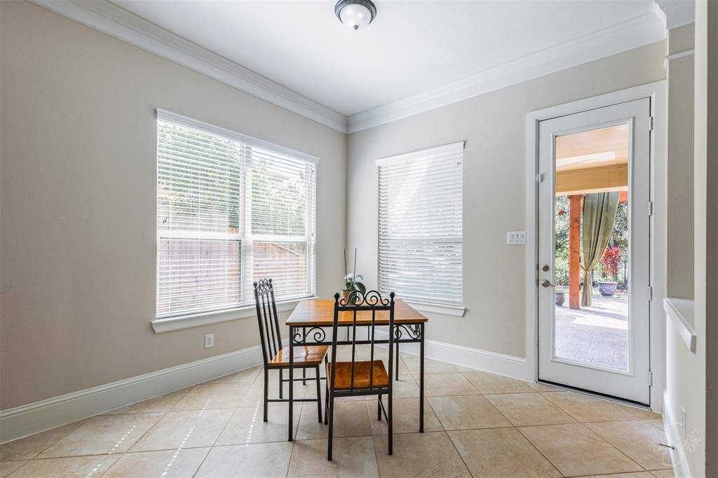 What a perfect place to start your day with a morning cup of coffee and breakfast! The cheerful breakfast room includes multiple windows with custom blinds and brings in natural light!