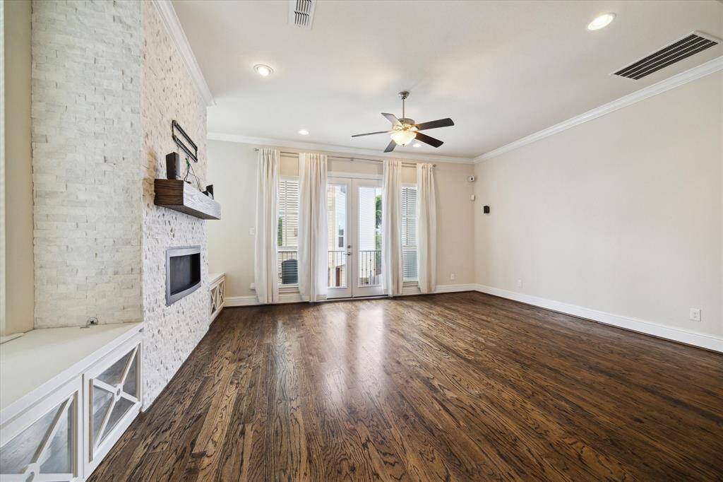 Spacious living room that leads to out door covered balcony