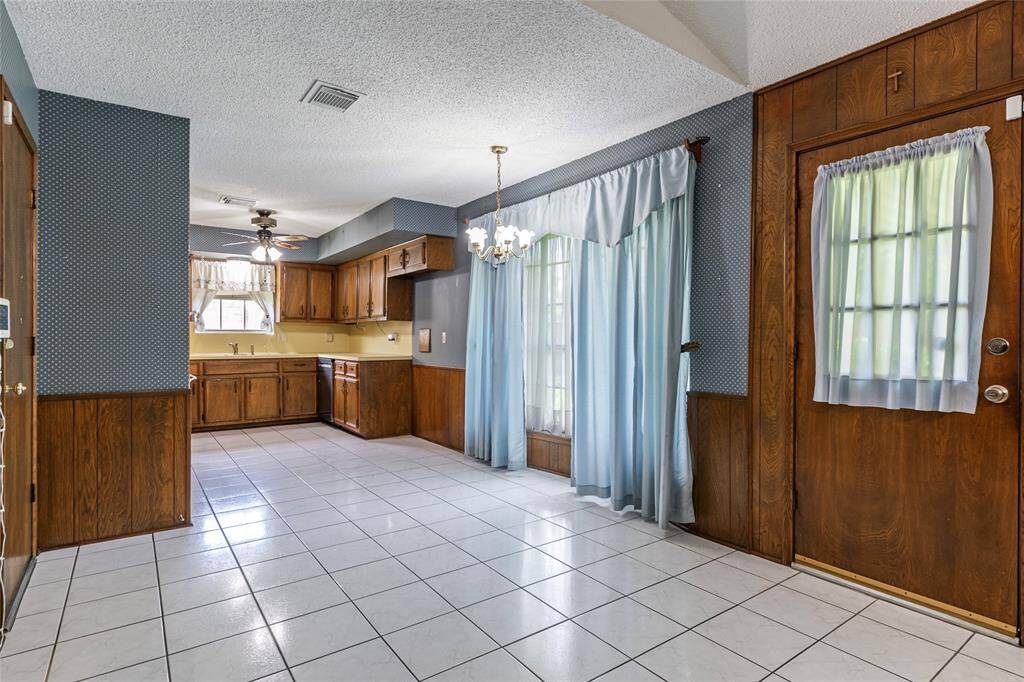 Enjoy cooking in the light-filled kitchen with an attached breakfast room that overlooks an expansive, fenced backyard—with no back neighbors for added privacy.