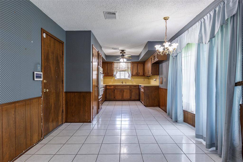 Bright breakfast room just off the kitchen with views of the private backyard.