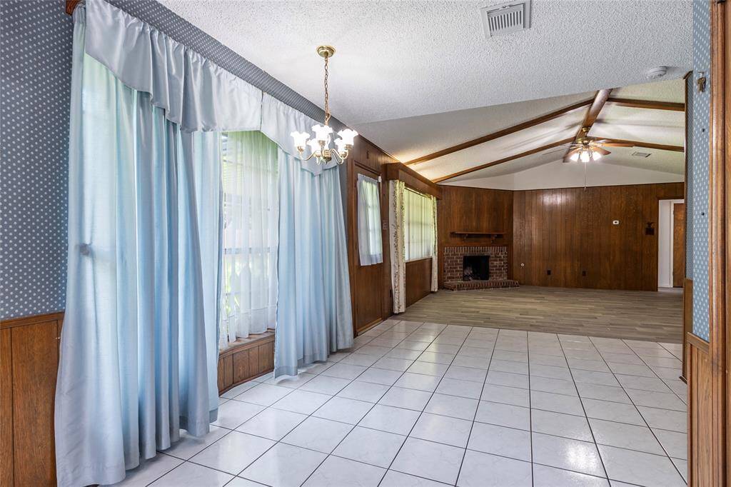 Light-filled breakfast nook just off the kitchen, overlooking the expansive backyard.