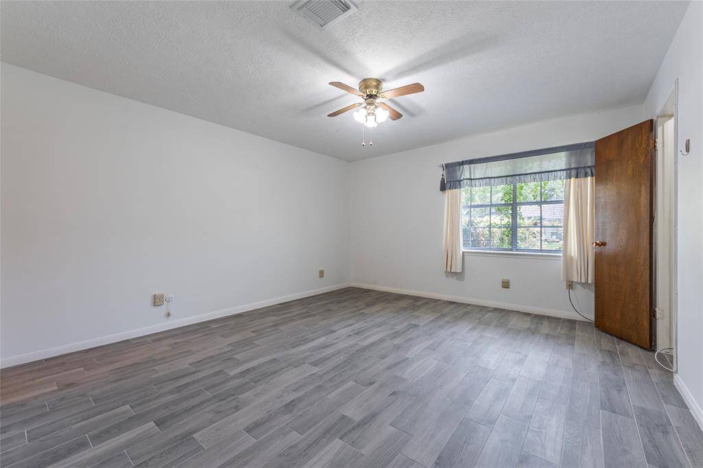 Primary suite offers plenty of room for large furniture