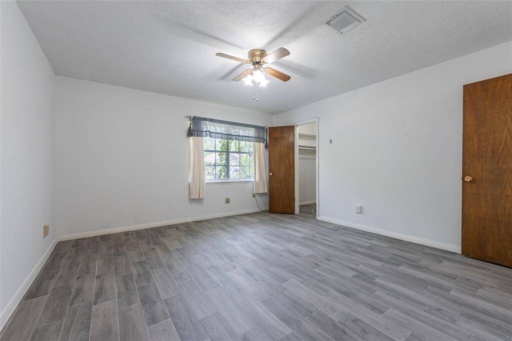 Relax in the large primary suite with fresh paint and new blinds.