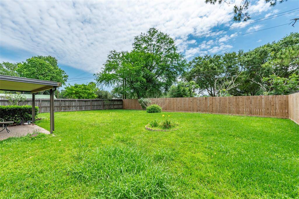 Expansive fenced backyard—no rear neighbors, just peace and privacy.