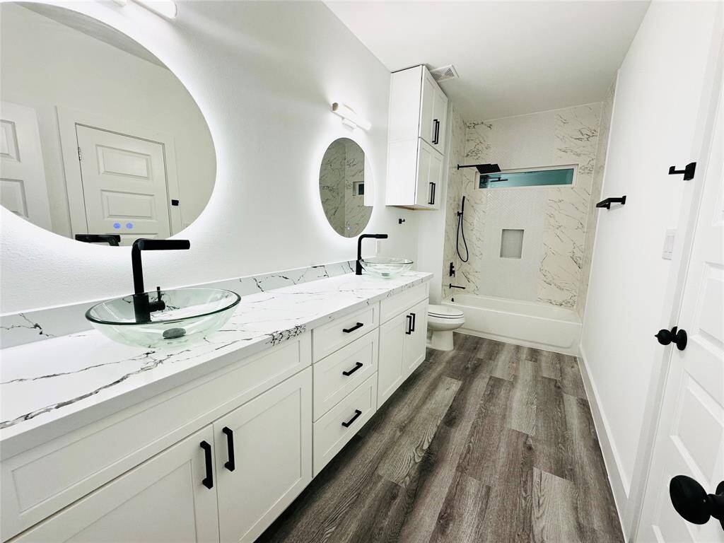 Will have similar finishes. Wake up to a magazine worthy bathroom every morning featuring beautiful quartz countertops, LED backlit multi function mirrors, glass vanity vessel sinks, double stacked solid wood head knocker cabinets w/ soft close doors over the toilet, spa grade faucets and hardware plus more. Buyer can choose between brushed Nickel or Matte Black faucets and hardware.
