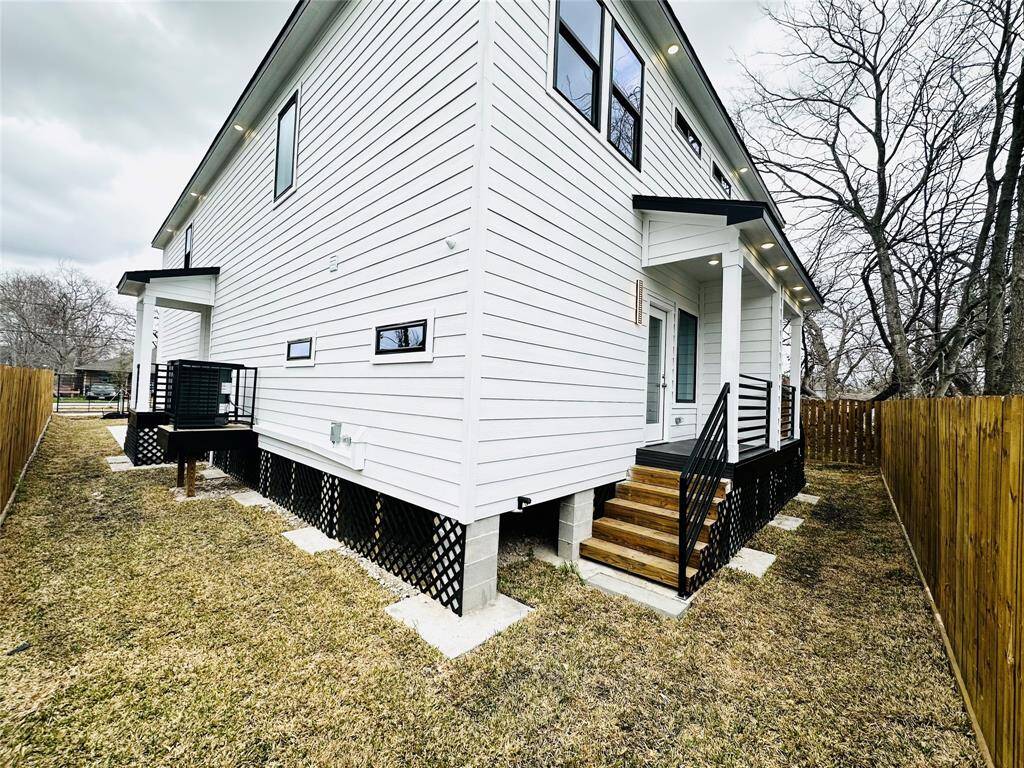 Each unit features covered back patio, recessed 360 degree LED soffit lighting, 2 inch wrought iron custom made handrails and balusters, and privacy fence w/ a wood picket gate to enclose the side yard & back yard.