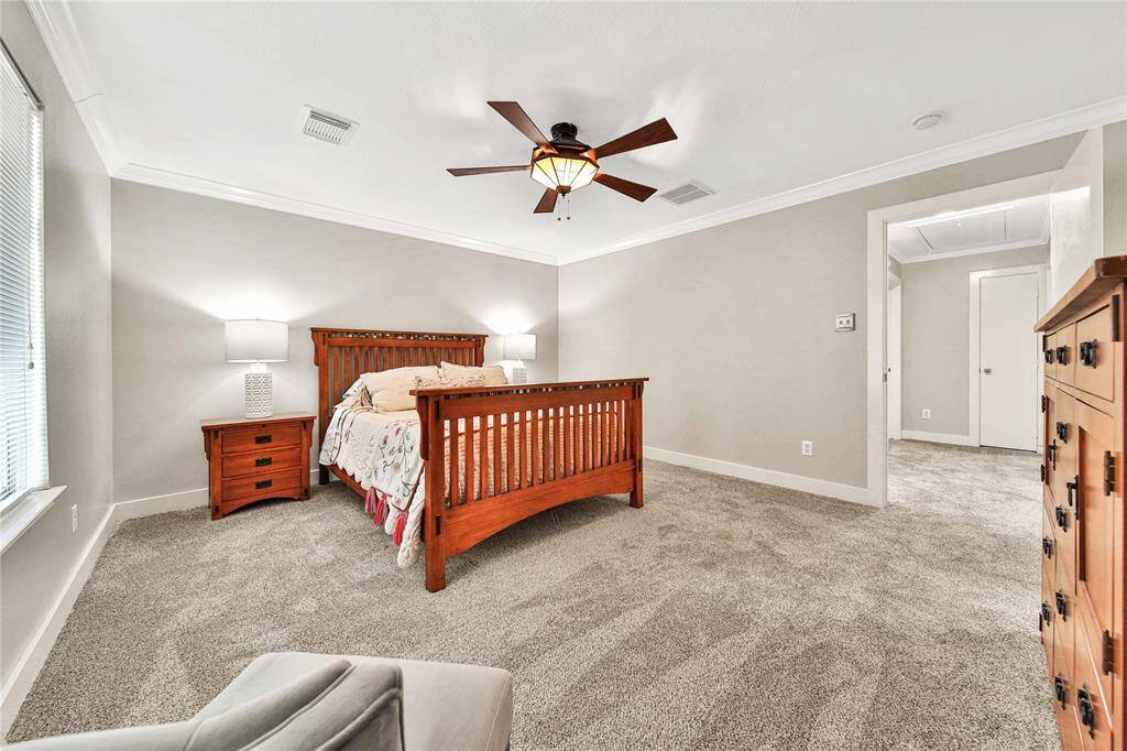 Spacious primary bedroom with renovated en-suite bathroom.