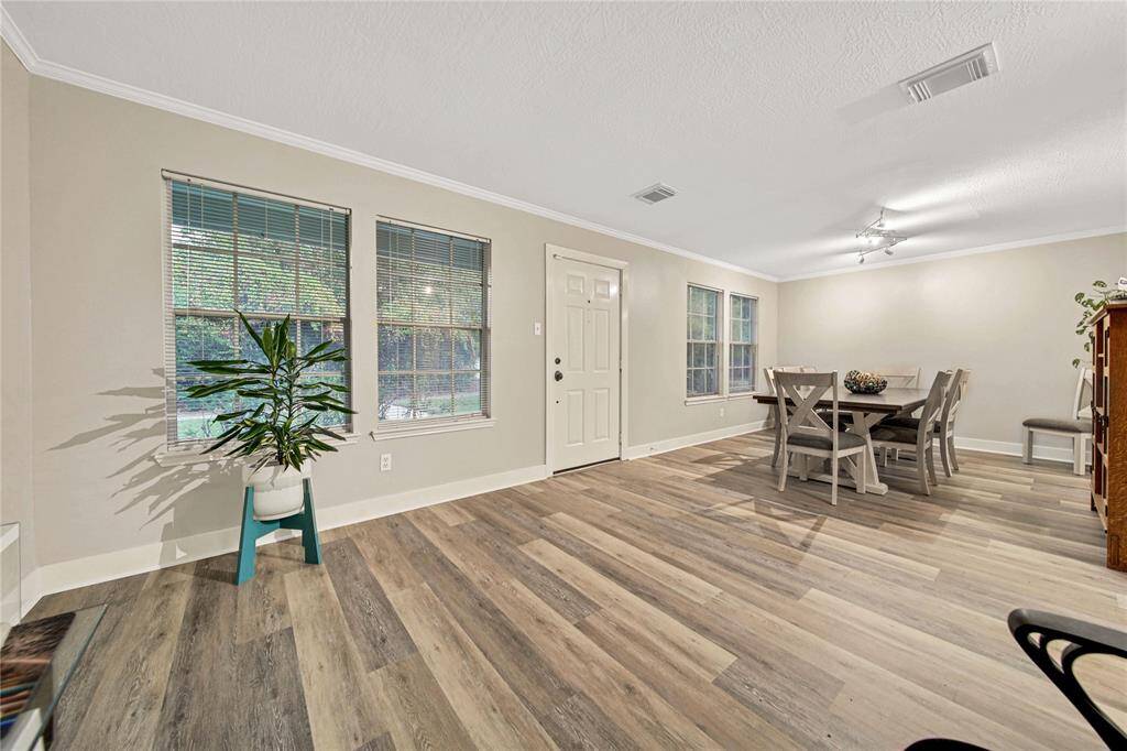 As you enter through the front you will be greeted by an open space with new vinyl plank flooring throughout the first floor.