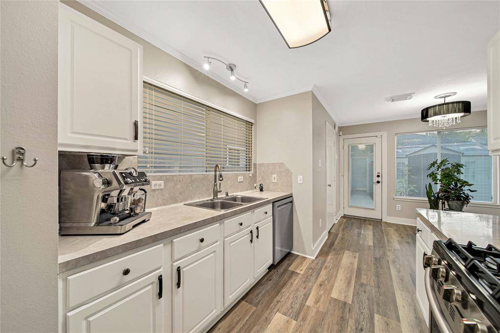 Step inside the kitchen, which features stainless steel appliances.