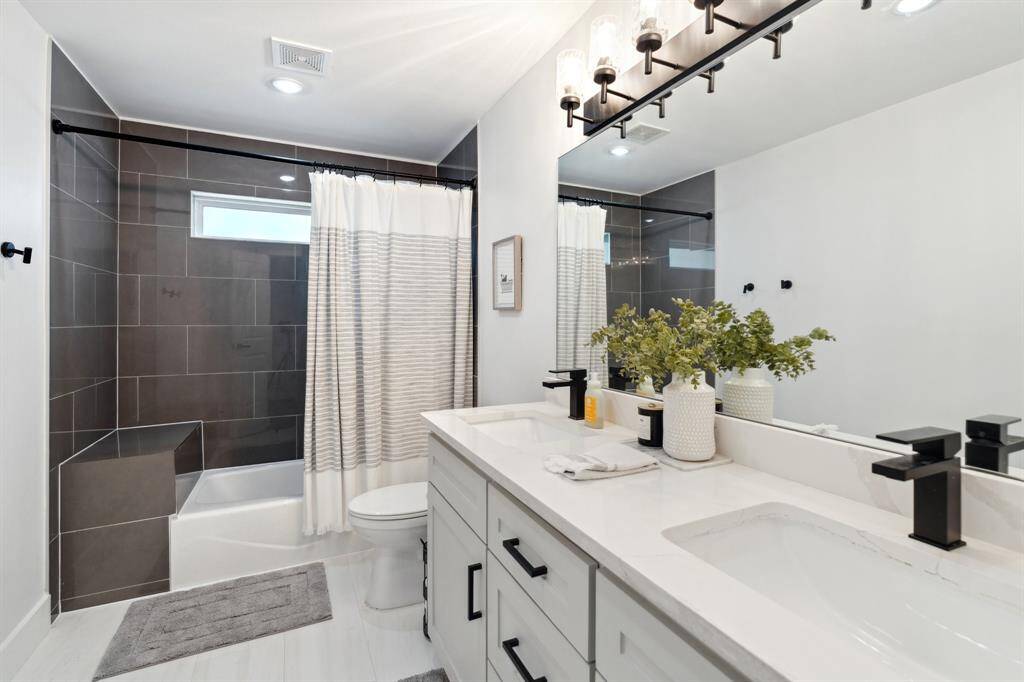 Double vanities in the full guest bathroom.