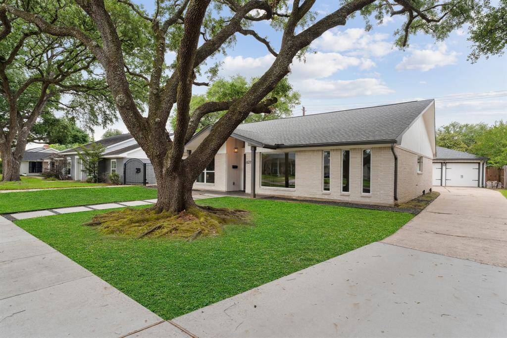 Long private drivewayGrass in photos have been digitally enhanced.