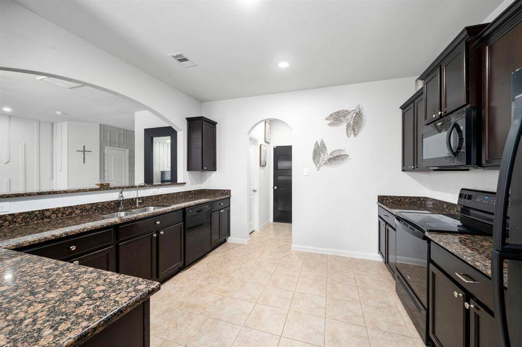 Nice opened kitchen overlooking living area.