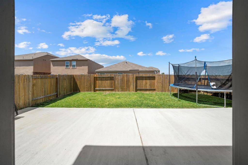 First view of the spacious backyard coming out of the house.