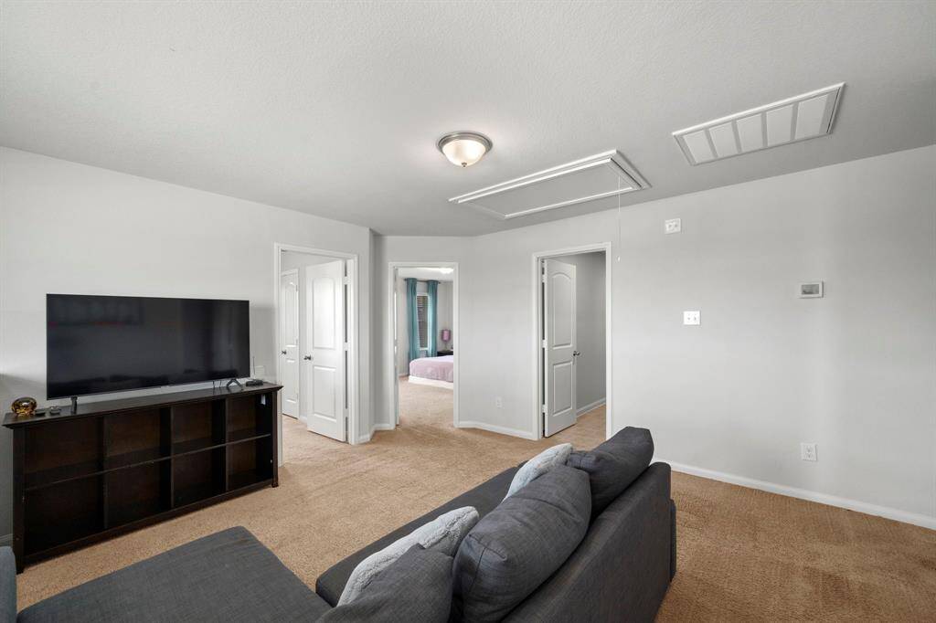 On the landing you will see this large living area. Great for upstairs guest or kids area.