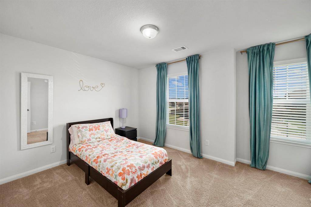 This is another secondary bedroom and its very large with great views of the neighborhood.