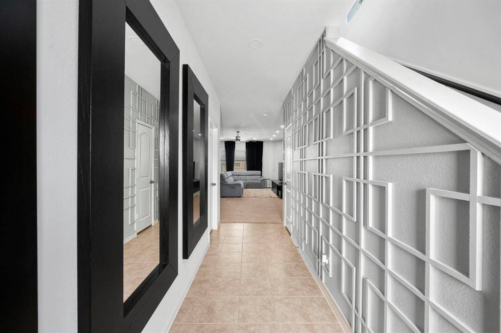 You are welcomed inside with a custom accent wall.