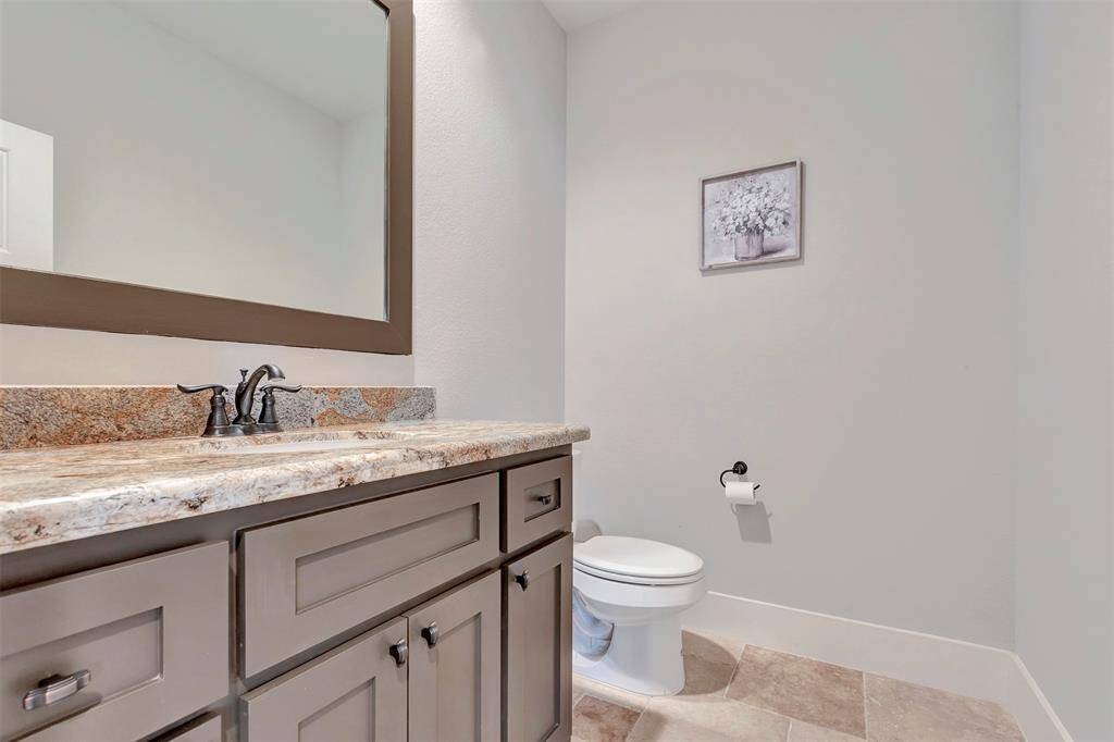 Half bathroom next to media room/flex room