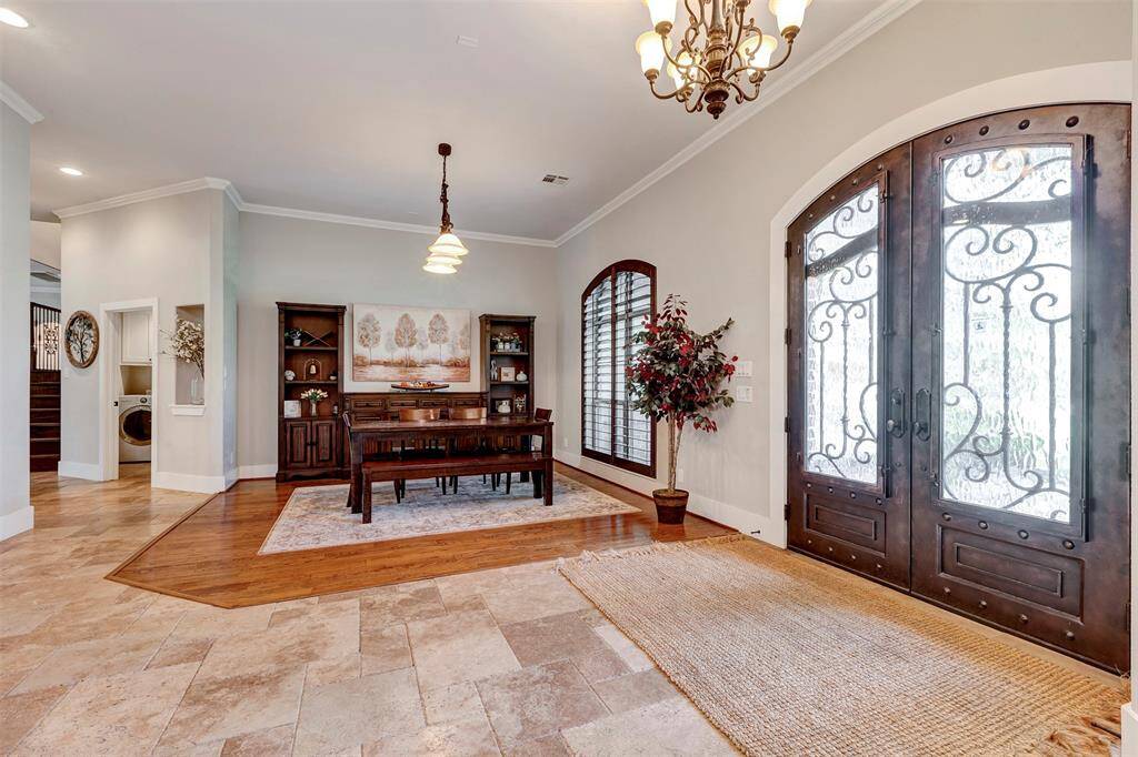 Spacious foyer with travertine flooring