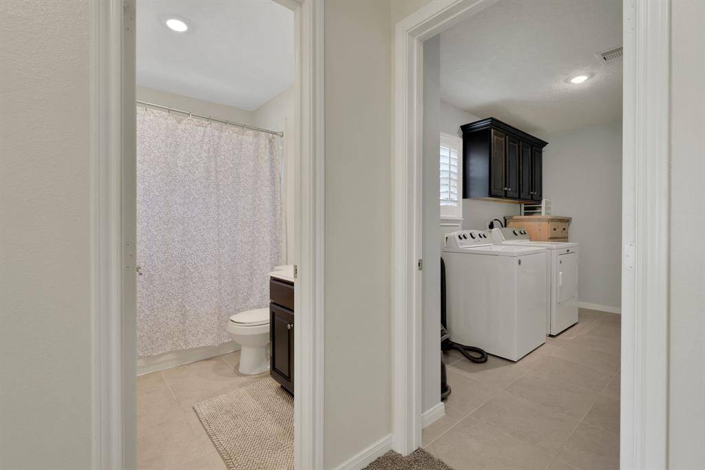 hall view toward hall bathroom and laundry room
