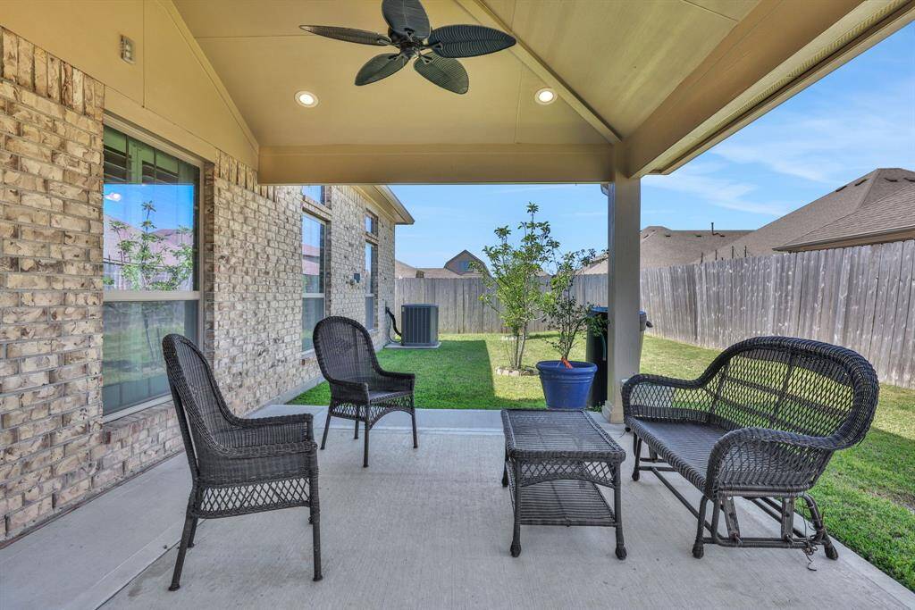 Beautiful custom extended back patio with full electric and ceiling fan.