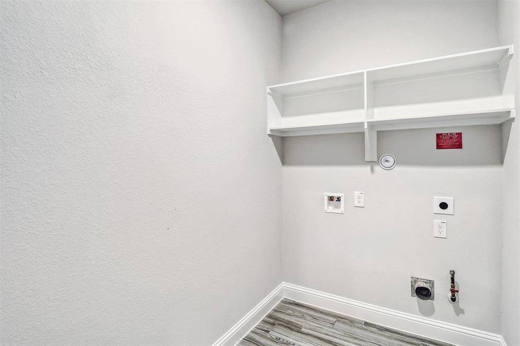 This spacious Utility Room has both gas and electric dryer connections.
