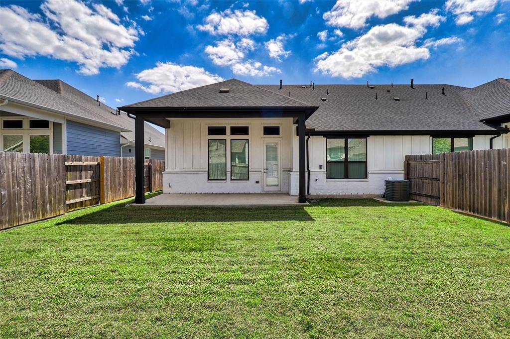 The large backyard is sprinklered and features a covered patio with a stubbed gas connection.