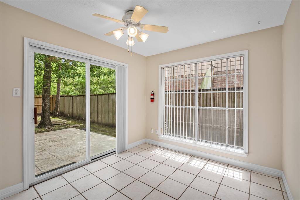 The breakfast room provides access to the rear lawn.