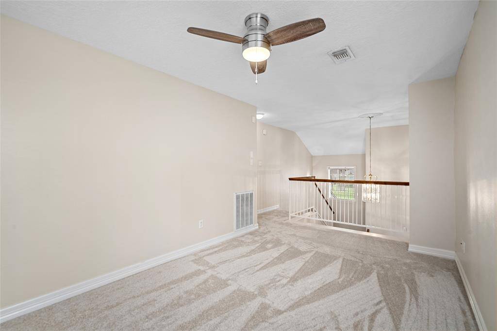 On the second floor is an open game room with new carpert.