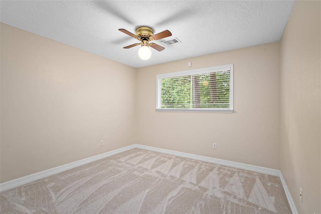 1 of 2 secondary bedrooms which overlook the back yard. New carpet installed.