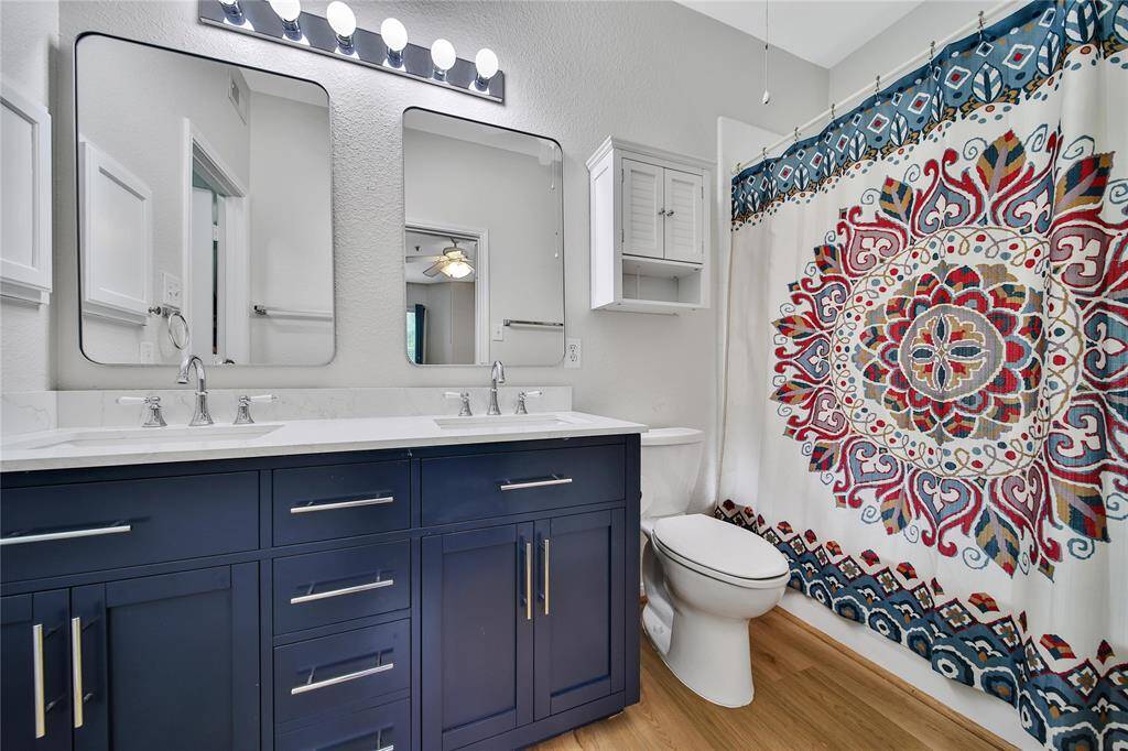 Primary bath with double sinks and new cabinetry.