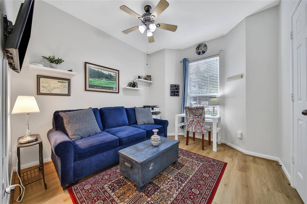Secondary bedroom currently being used as an office space. Closets have convenient systems added for better storage.