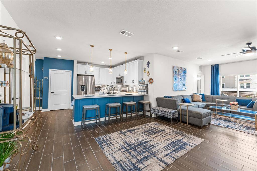 Welcome to your next chapter.This open-concept living space is the heart of the home—offering natural light, thoughtful flow, and endless potential to relax, entertain, or create your perfect everyday retreat.