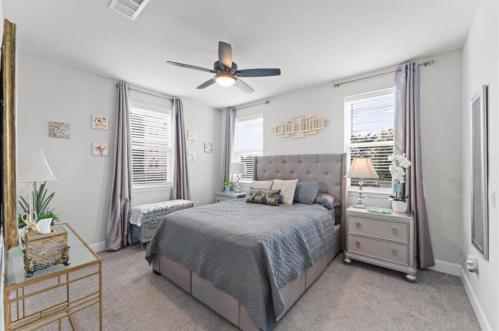 Comfortable and well-sized with multiple windows—perfect as a guest suite, nursery, home office, or long-term secondary bedroom.